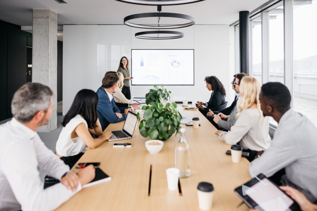 Team meeting in a modern conference room with a presentation.